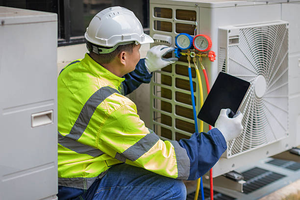 Professional Hvac technician working in Adell, WI